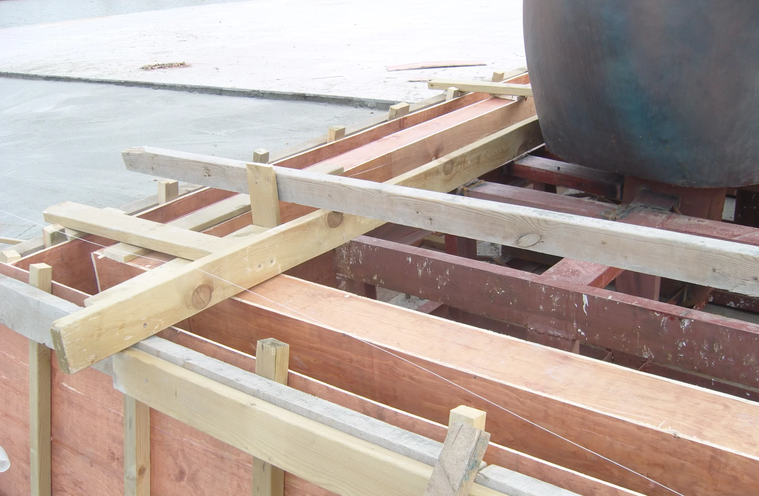 Close-up of a large wooden shipping crate used for transporting oversized outdoor sculptures