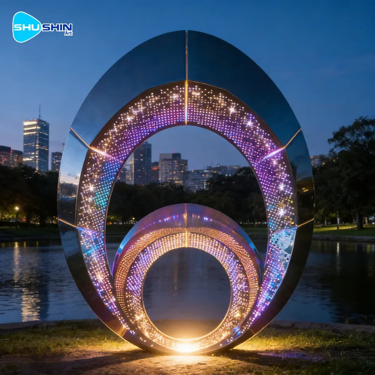 Illuminated stainless steel sculpture for an urban landscape setting.