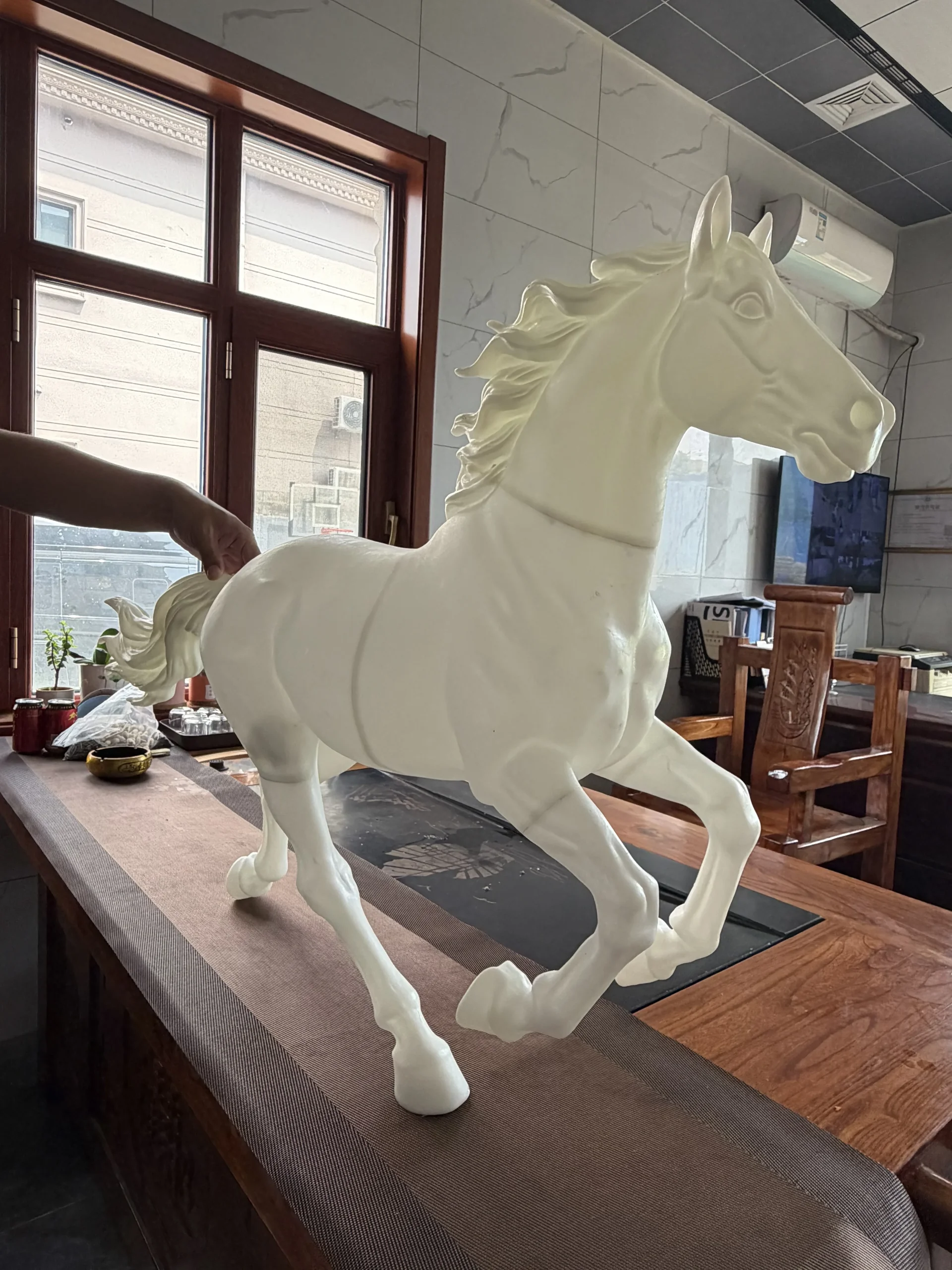 Close-up of plaster model tail detail on a bronze horse sculpture