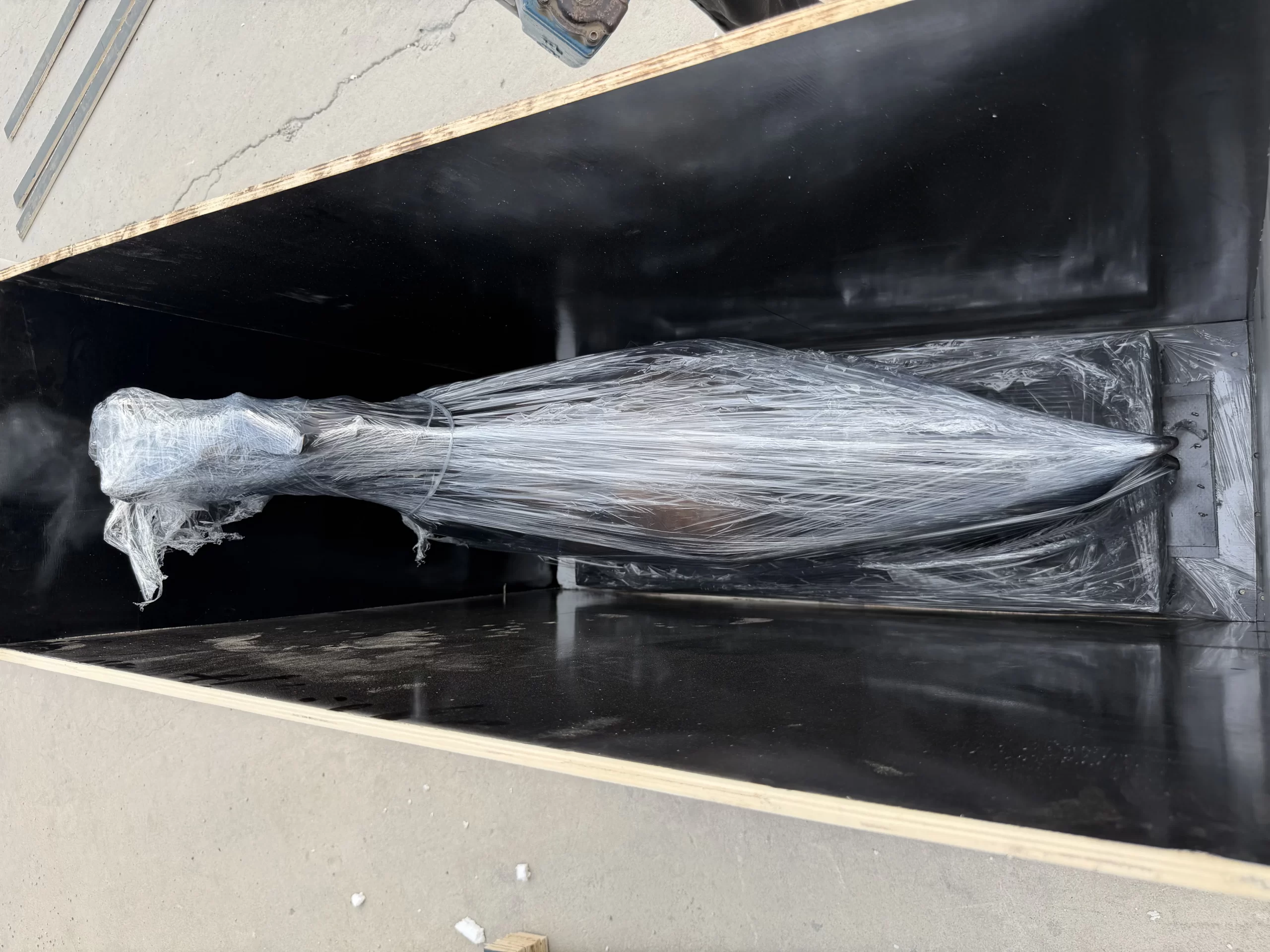 Bronze horse sculpture placed in a wooden crate with wrapping for protective packing preparation